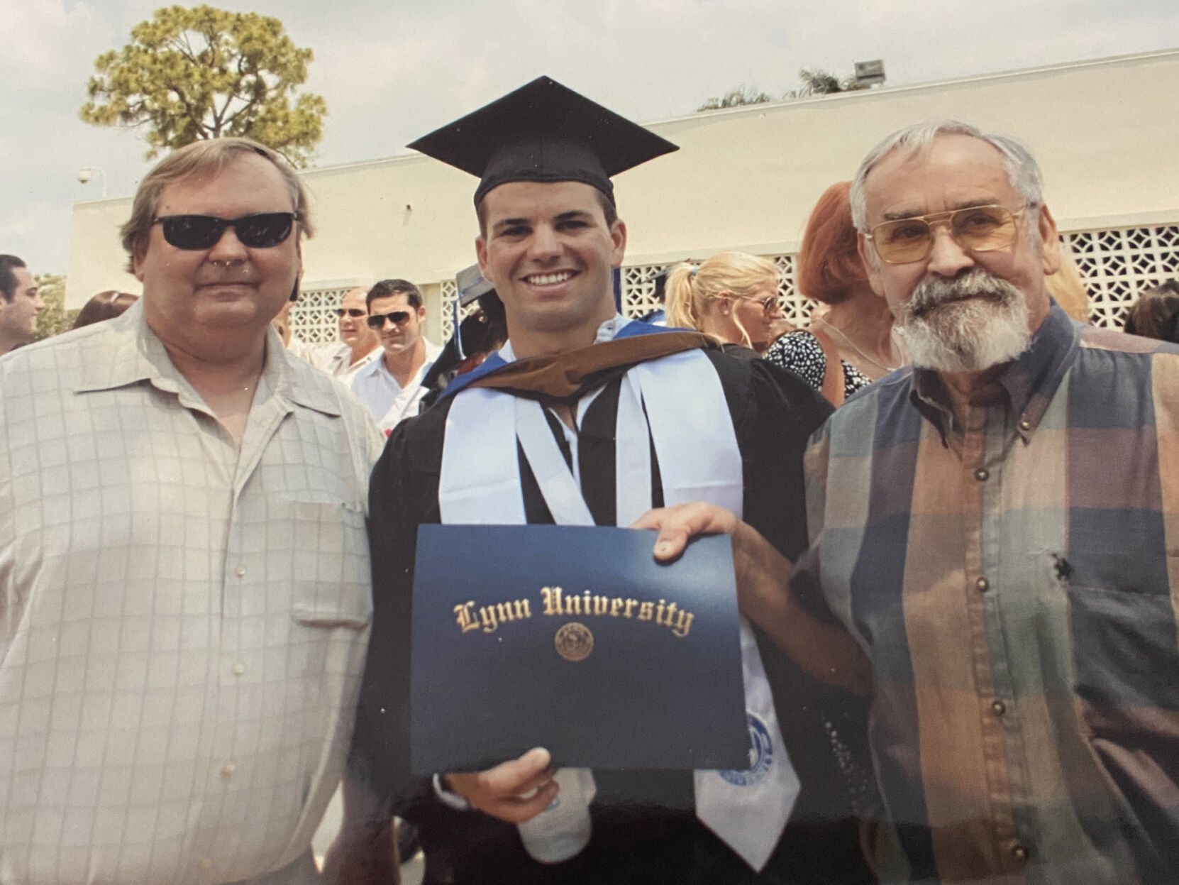 Navy veteran Bill Smith with son, grandson